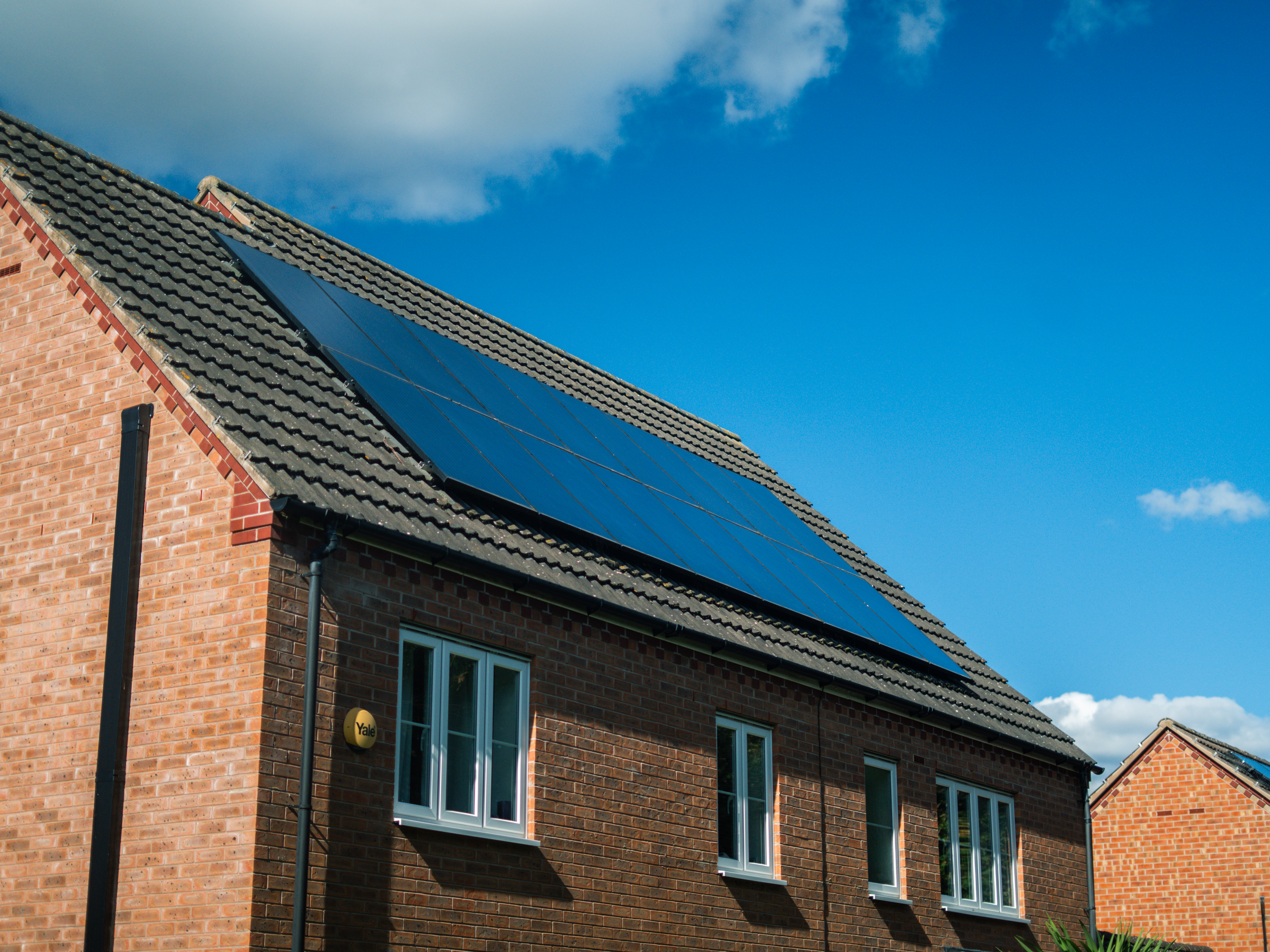 a house with solar pannels on the roof